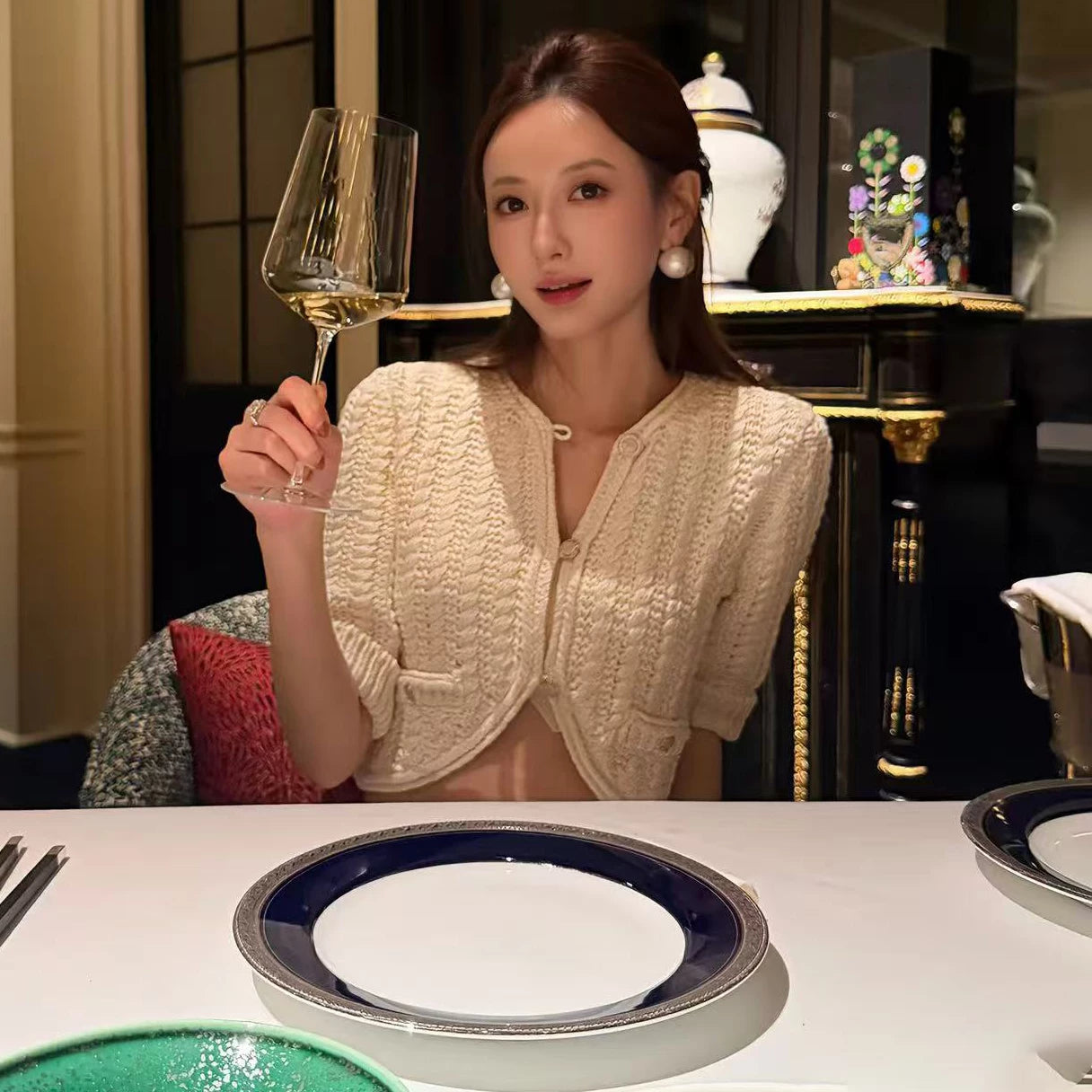 2025 autumn and winter temperament heavy industry hollow age-reducing twist knitted button-up cardigan short small long-sleeved top women