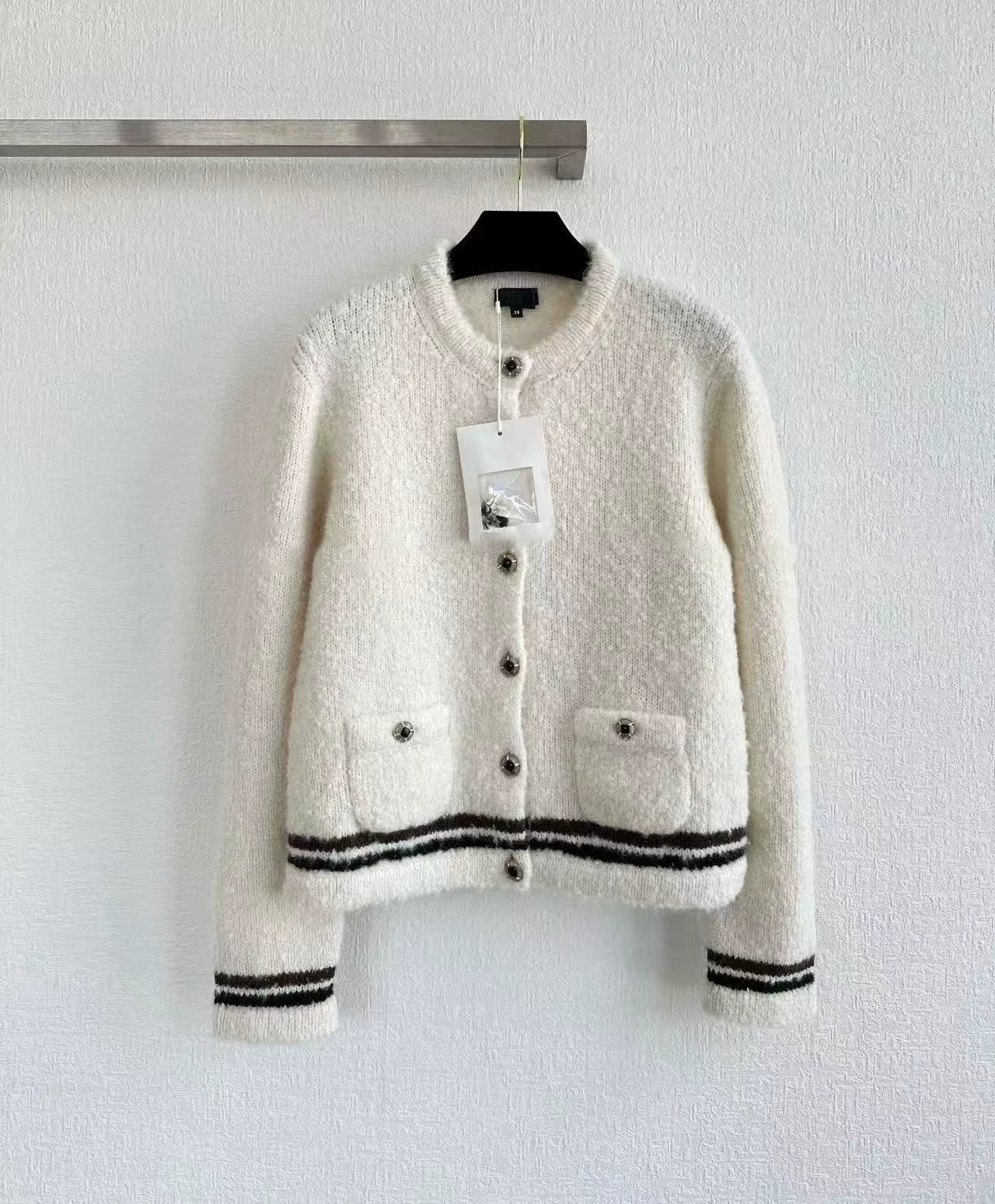 2025 autumn and winter foreign style fashionable skiing bow girlish knitted short-sleeved cardigan + high waist skirt women's suit