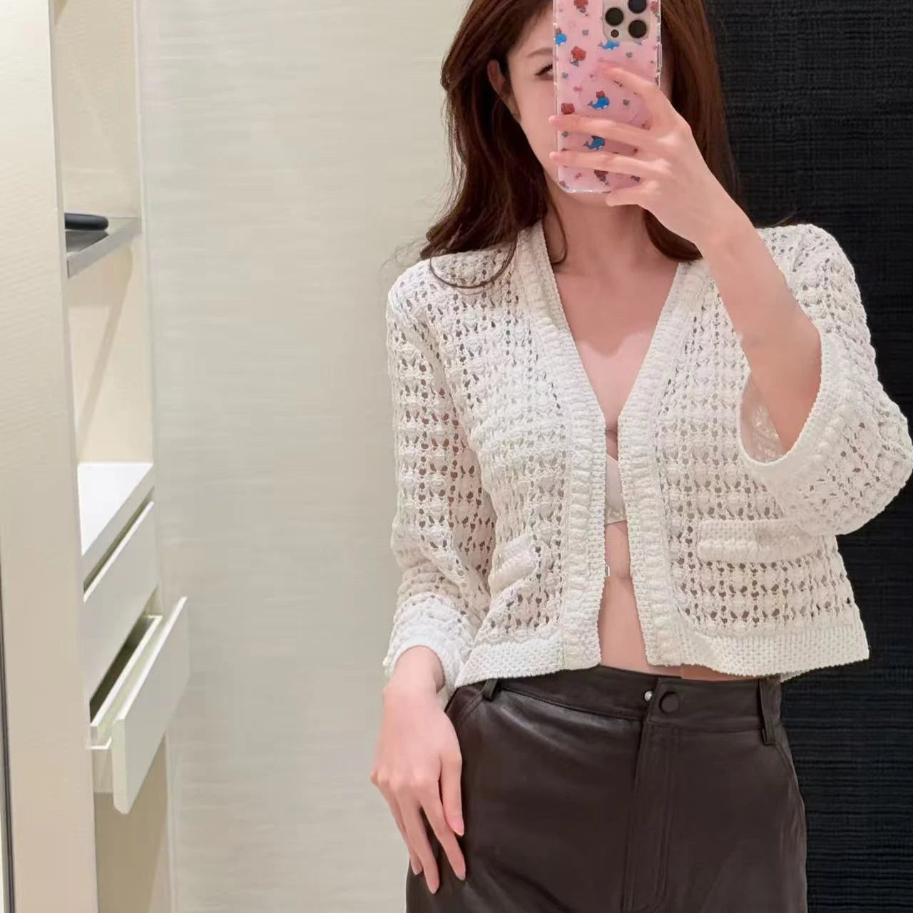 2025 autumn and winter temperament heavy industry hollow age-reducing twist knitted button-up cardigan short small long-sleeved top women
